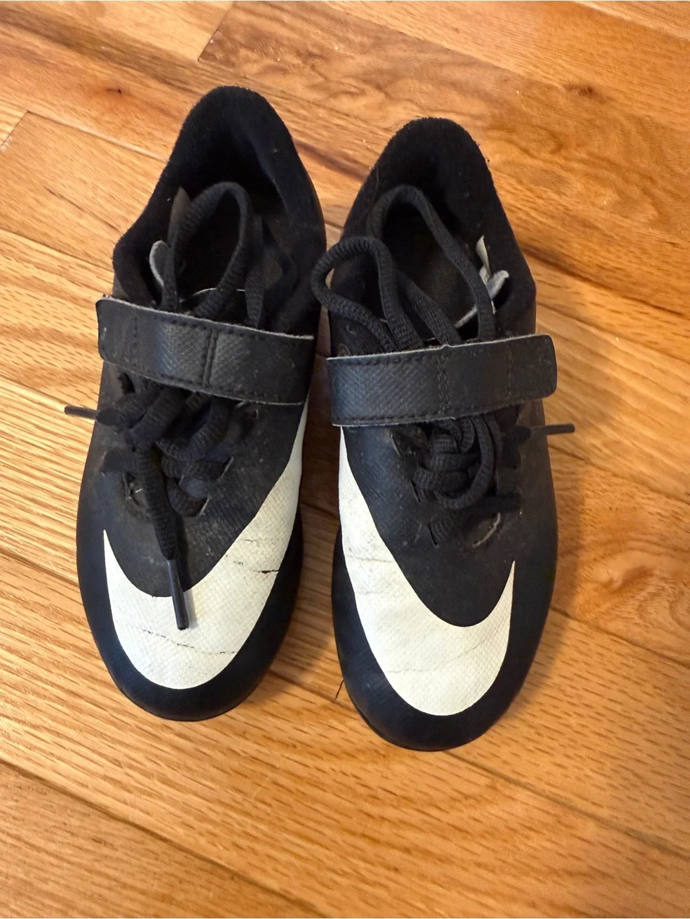 Nike Kids Black Soccer Cleats with White Swoosh